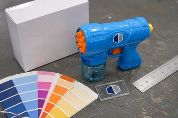 Color chips, logo sample and blank color box on the OEM review table