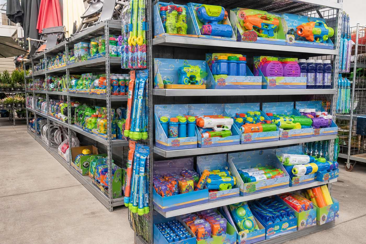 Outdoor play products merchandised on a garden-center shelf